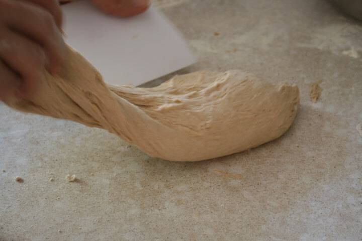 kneading pizza dough